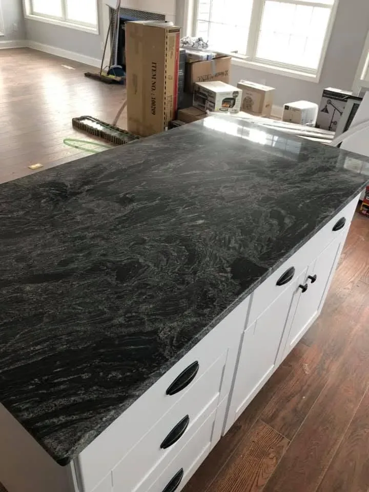 Kitchen island with dark granite top