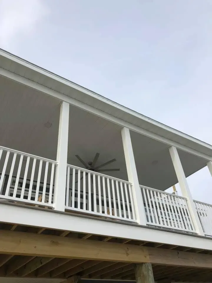 Covered porch with white railings