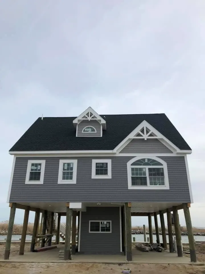 Two-story coastal home raised on pilings