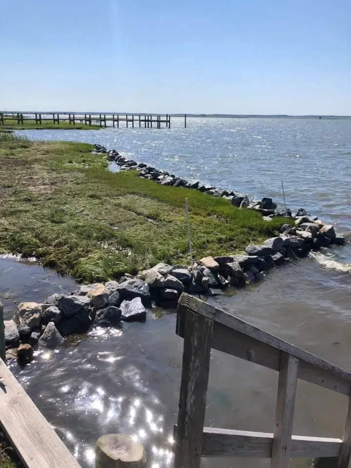 Stone rip-rap protecting a marsh shoreline